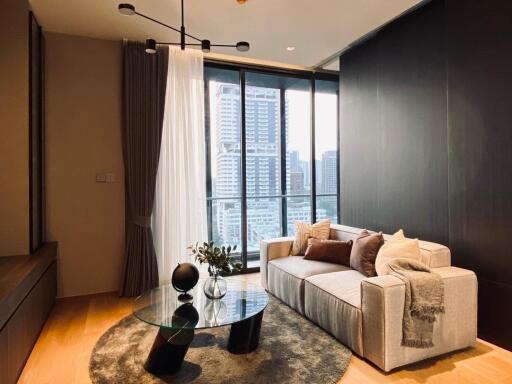 Modern living room with large windows and city view