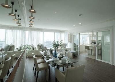 Modern living room with dining area and large windows