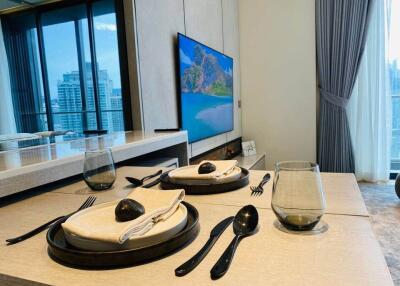 Modern dining area with table setting and large window view