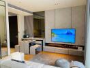 Modern living room with wall-mounted TV and electric fireplace