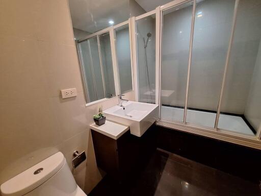 Modern bathroom with glass-enclosed shower