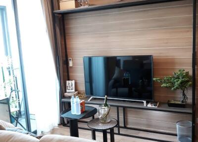 Living room with wall-mounted TV and contemporary decor