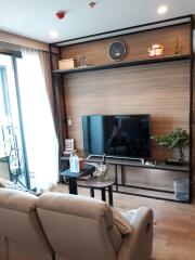 Living room with wall-mounted TV and contemporary decor