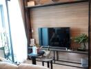 Living room with wall-mounted TV and contemporary decor