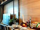 Dining area with a modern table setup, television, and air conditioner