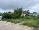 Outdoor view of a residential neighborhood with houses surrounded by vegetation