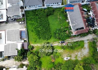 Aerial view of residential area with a mixture of houses and green patches