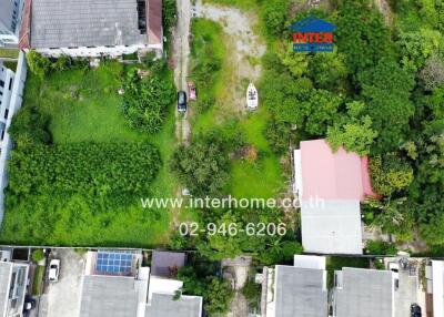 Aerial view of residential buildings and green spaces