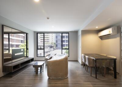 Bright, modern living room with dining area