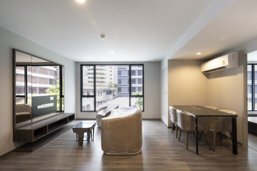 Bright, modern living room with dining area