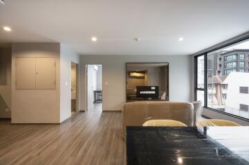 Modern living area with large windows and comfortable seating