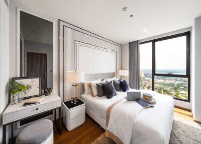 Modern bedroom with large window and city view