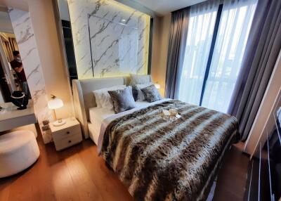 Modern bedroom with large windows and stylish decor