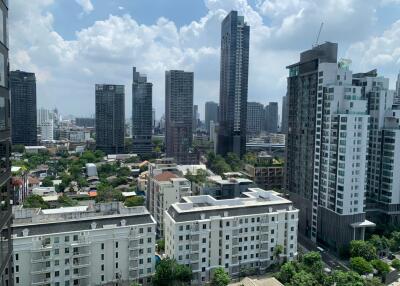 View from a high-rise showing a cityscape with various residential and commercial buildings