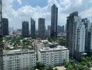 View from a high-rise showing a cityscape with various residential and commercial buildings