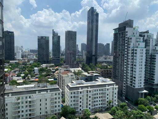 View from a high-rise showing a cityscape with various residential and commercial buildings