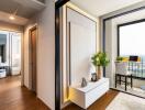 A modern apartment with a hallway leading to a home office and a balcony.