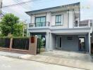 Two-story residential house with a driveway