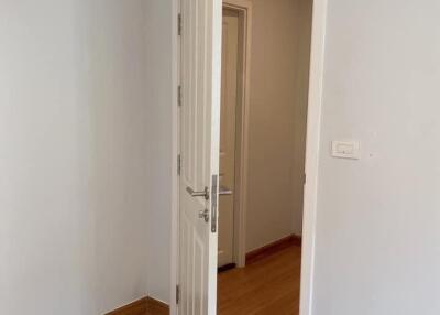 Open door leading to a hallway