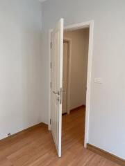 Open door leading to a hallway