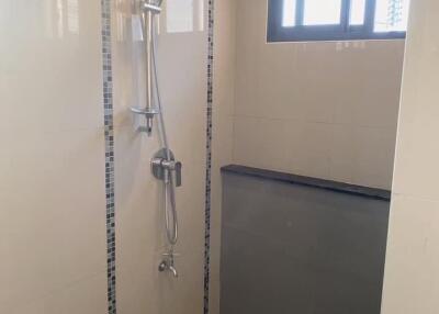 Modern shower area with window