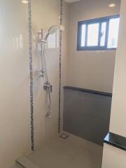 Modern shower area with window