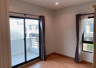 Modern bedroom with sliding glass doors and windows