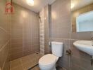 Modern bathroom with shower and neutral tiles