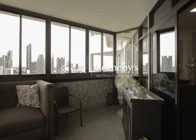 Indoor balcony with seating and city view