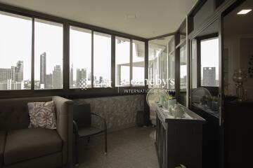 Indoor balcony with seating and city view