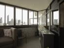 Indoor balcony with seating and city view