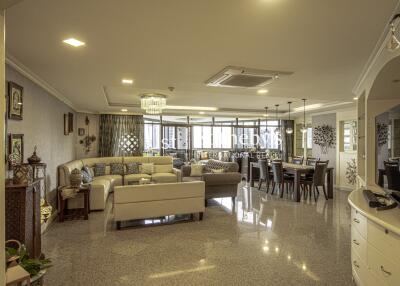 Spacious living and dining area with modern decor and ample natural light