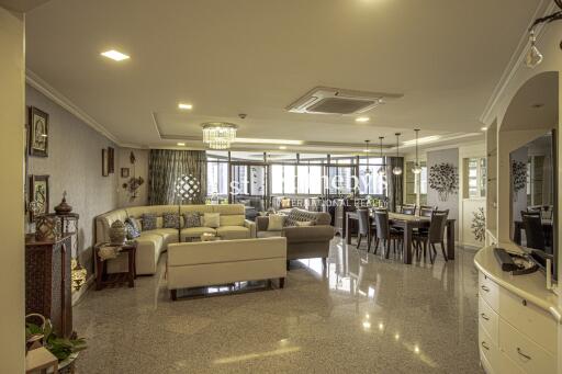 Spacious living and dining area with modern decor and ample natural light