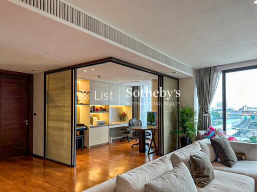 Modern living room with home office area