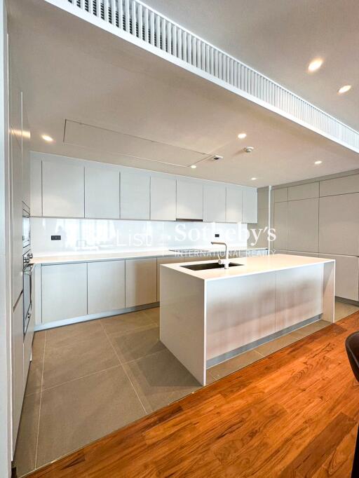 Modern kitchen with white cabinets and large island