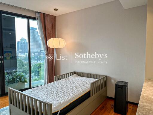 Bedroom with a single bed and a view of the city