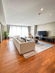 Spacious living room with modern decor and natural light