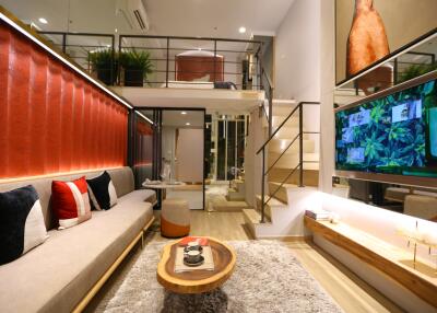 Stylish living room with loft, modern decor and TV