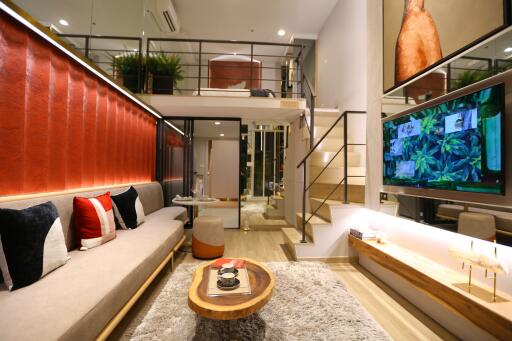 Stylish living room with loft, modern decor and TV