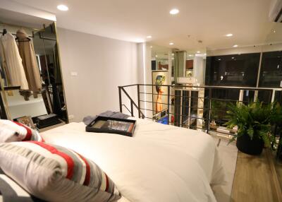 Bright bedroom with modern decor and mezzanine view