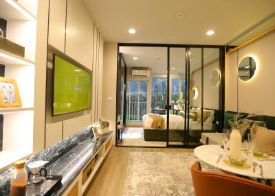 Modern living area with adjoining bedroom