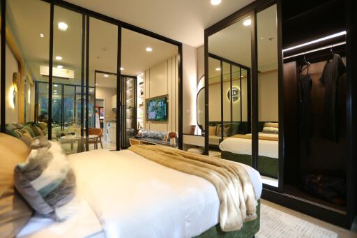 Modern bedroom with large mirrors and open closet