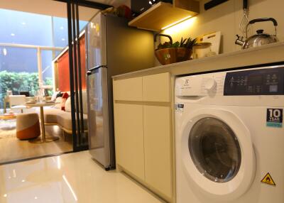 Modern kitchen with appliances and view to living area