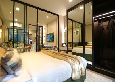 Modern bedroom with mirrored wardrobe and decorative lighting