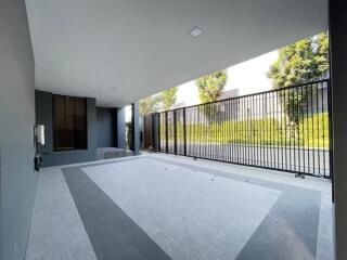 Covered garage area with gated wall