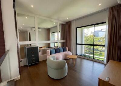 Spacious living room with modern furniture and a large window