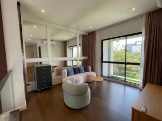 Spacious living room with modern furniture and a large window