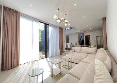 Modern living room with large windows and sectional sofa