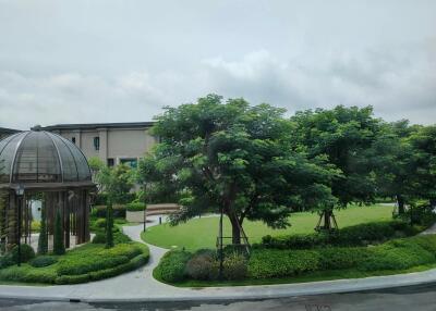 Beautiful garden view with trees and gazebo