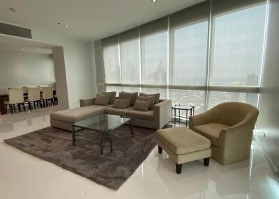 Modern living room with large windows and city view